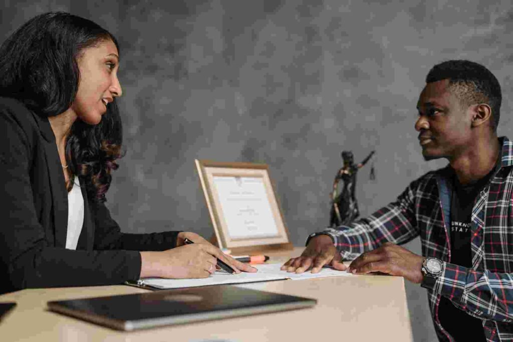 motorcycle accident lawyer talking to her client