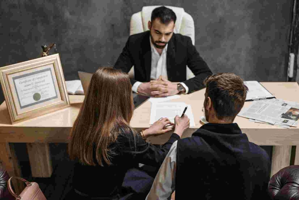 motorcycle accident lawyer meeting with his clients