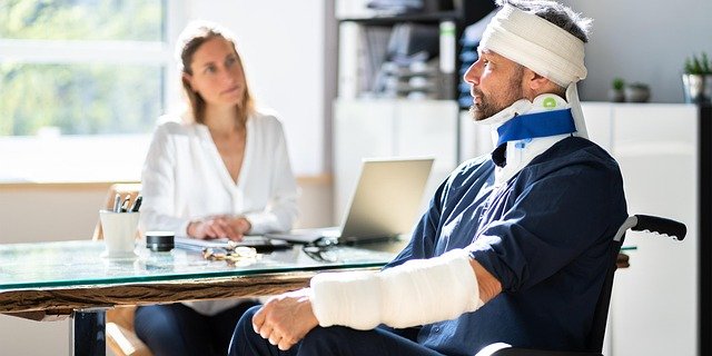 an injured man hiring a slip and fall lawyer